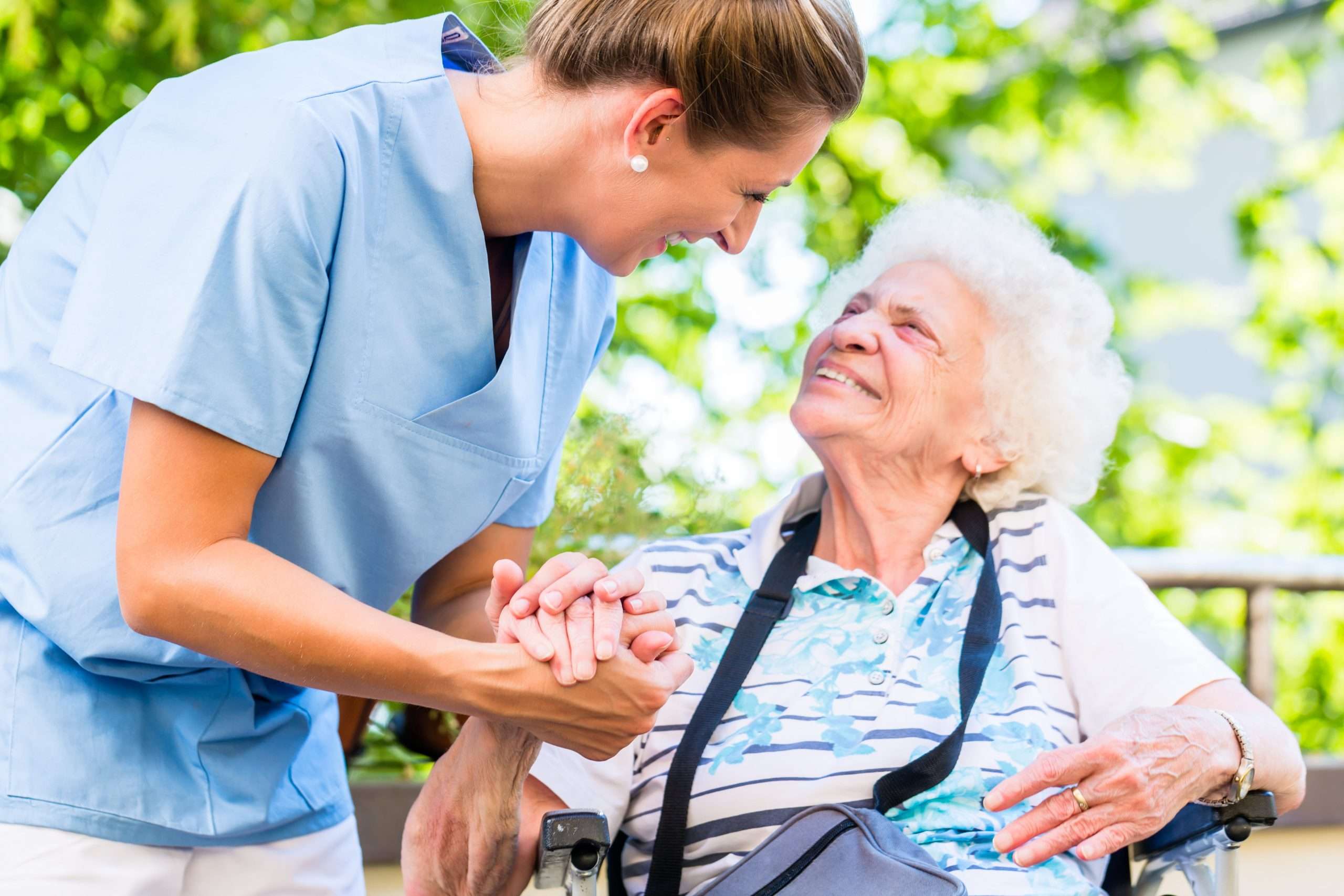 An elderly lady with a live in care professional