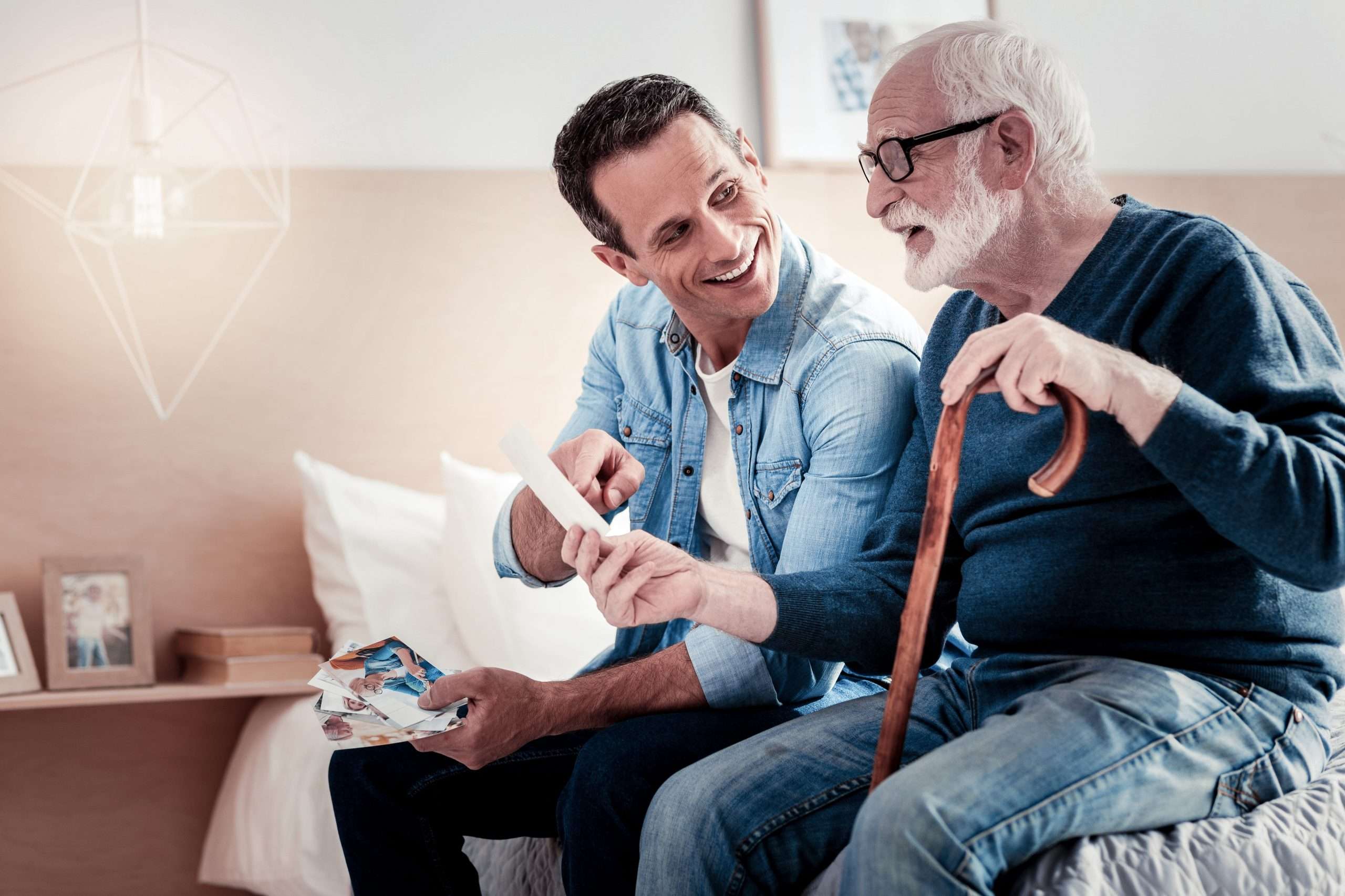 person-centred-care-3 person-centred care, a care professional sat on the bed with a client